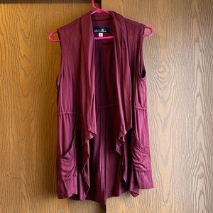 Lightweight, burgundy vest, adjustable waist, slightly longer in the back